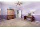 Purple bedroom with carpet, two-tone walls, and a ceiling fan at 21256 E Waverly Dr, Queen Creek, AZ 85142