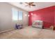 Bedroom featuring a large window, ceiling fan, and furnishings at 21256 E Waverly Dr, Queen Creek, AZ 85142