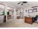 Open-concept space with neutral walls and carpet flooring connects multiple living areas in the home at 21256 E Waverly Dr, Queen Creek, AZ 85142