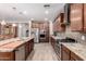 Gourmet kitchen with stainless steel appliances, granite countertops, ample cabinet space, and modern fixtures at 21256 E Waverly Dr, Queen Creek, AZ 85142