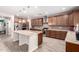 Spacious kitchen featuring a large island with granite countertops, stainless steel appliances, and ample cabinet space at 21256 E Waverly Dr, Queen Creek, AZ 85142