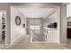 Cozy upstairs landing area featuring neutral carpeting, a decorative mirror, and natural light from a nearby window at 21256 E Waverly Dr, Queen Creek, AZ 85142