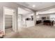 Upstairs landing featuring neutral carpeting and decor, with views into multiple living areas and a storage closet at 21256 E Waverly Dr, Queen Creek, AZ 85142