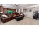 Inviting living room with plush, reclining leather seating and custom built-in bookshelves at 21256 E Waverly Dr, Queen Creek, AZ 85142