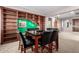 Inviting living room with a breakfast table and custom built-in bookshelves at 21256 E Waverly Dr, Queen Creek, AZ 85142