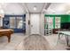 Open-concept room with durable flooring, offering views into other rooms, and neutral walls at 21256 E Waverly Dr, Queen Creek, AZ 85142