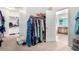 A secondary view of the walk-in closet shows the storage space and entryway to the ensuite bathroom at 21256 E Waverly Dr, Queen Creek, AZ 85142