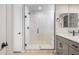Contemporary bathroom featuring a walk-in shower with white tiles and a built-in seat at 21288 N 272Nd Ln, Buckeye, AZ 85396