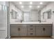 Stylish bathroom with dual sinks, a large mirror, and modern fixtures at 21288 N 272Nd Ln, Buckeye, AZ 85396