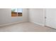 Neutral bedroom with tiled floors and a bright window at 21288 N 272Nd Ln, Buckeye, AZ 85396
