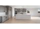 Modern kitchen with gray cabinetry, white countertops and an island at 21288 N 272Nd Ln, Buckeye, AZ 85396
