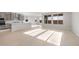 Open concept living space with a combined kitchen, living and dining area at 21288 N 272Nd Ln, Buckeye, AZ 85396