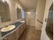 Bathroom features double sinks, tile flooring and glass enclosed shower at 2233 E Behrend Dr # 85, Phoenix, AZ 85024