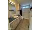 Bathroom showcasing a single sink vanity, tiled floors, and shower with tile walls at 2233 E Behrend Dr # 85, Phoenix, AZ 85024