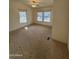 Spacious carpeted bedroom with ceiling fan, offering plenty of natural light at 2233 E Behrend Dr # 85, Phoenix, AZ 85024
