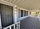 Inviting front porch with security door, offering style and protection at 2233 E Behrend Dr # 85, Phoenix, AZ 85024