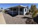 Inviting home exterior with covered porch and xeriscaping for easy maintenance at 2233 E Behrend Dr # 85, Phoenix, AZ 85024