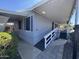 Inviting single-story home with covered porch, wheelchair ramp, and desert landscaping at 2233 E Behrend Dr # 85, Phoenix, AZ 85024