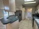 Bright kitchen featuring tile flooring, light wood cabinetry, and stainless steel appliances at 2233 E Behrend Dr # 85, Phoenix, AZ 85024