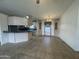 Open-concept living and dining area with tile floors and neutral color scheme at 2233 E Behrend Dr # 85, Phoenix, AZ 85024