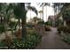 Landscaped pathway with desert foliage leading to a building, enhancing the community's serene atmosphere at 2233 E Behrend Dr # 85, Phoenix, AZ 85024