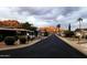Scenic street view showcasing well-maintained homes and landscaping in a vibrant manufactured home community at 2233 E Behrend Dr # 85, Phoenix, AZ 85024
