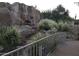 Rock waterfall feature with bridge, enhancing the natural beauty of the community at 2233 E Behrend Dr # 85, Phoenix, AZ 85024