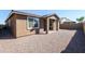 Rear exterior view of the house with a gravel-filled backyard at 22463 E Rosa Rd, Queen Creek, AZ 85142