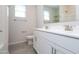 Bright bathroom featuring double vanity, white cabinets, and tiled floor at 22463 E Rosa Rd, Queen Creek, AZ 85142
