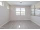 Cozy bedroom featuring tile floors and a window with blinds at 22463 E Rosa Rd, Queen Creek, AZ 85142