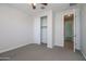 Bedroom featuring a closet with sliding doors and a view to the hallway at 22463 E Rosa Rd, Queen Creek, AZ 85142