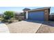 Lovely single-story home with stone driveway and desert landscaping at 22463 E Rosa Rd, Queen Creek, AZ 85142