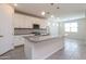Kitchen featuring a large island with pendant lights, stainless appliances, and white cabinets at 22463 E Rosa Rd, Queen Creek, AZ 85142