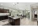 Spacious open kitchen with stainless steel appliances and a granite island at 2424 S 235Th Dr, Buckeye, AZ 85326