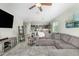Open concept living room featuring tile flooring and a view into the kitchen at 2424 S 235Th Dr, Buckeye, AZ 85326