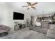 Open concept living room featuring tile flooring and a view into the kitchen at 2424 S 235Th Dr, Buckeye, AZ 85326