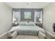 Inviting bedroom featuring neutral decor, and a decorative bench at 2424 S 235Th Dr, Buckeye, AZ 85326