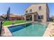 Beautiful backyard with a refreshing pool, lush turf, and a built-in outdoor grill area at 2765 E Gillcrest Rd, Gilbert, AZ 85298