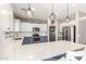 Bright kitchen features a breakfast bar with white counter, pendant lights, and stainless steel appliances at 2765 E Gillcrest Rd, Gilbert, AZ 85298