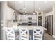 Bright kitchen features a breakfast bar with white counter, pendant lights, and stainless steel appliances at 2765 E Gillcrest Rd, Gilbert, AZ 85298