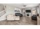 Open living room showcasing an entertainment center, and a staircase with wood accent wall nearby at 2765 E Gillcrest Rd, Gilbert, AZ 85298