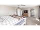 Large main bedroom with a gray and white bedspread, neutral carpet, and a dresser at 2765 E Gillcrest Rd, Gilbert, AZ 85298
