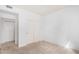 Bedroom boasts neutral carpeting, modern closets and adjacent door creating an open feel at 29606 N Tatum Blvd # 121, Cave Creek, AZ 85331