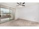 Bright bedroom features a sliding glass door leading to a private balcony with community views at 29606 N Tatum Blvd # 121, Cave Creek, AZ 85331