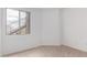Cozy bedroom with carpet, a bright window with natural light and views of the community stairs at 29606 N Tatum Blvd # 121, Cave Creek, AZ 85331