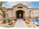 Inviting clubhouse entrance with manicured landscaping and charming details at 29606 N Tatum Blvd # 121, Cave Creek, AZ 85331