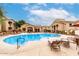 Resort-style community pool with ample lounge seating and shade umbrellas at 29606 N Tatum Blvd # 121, Cave Creek, AZ 85331