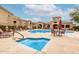 Inviting community pool and hot tub with outdoor seating areas at 29606 N Tatum Blvd # 121, Cave Creek, AZ 85331