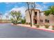 Apartment building featuring exterior stairs and mature trees for a modern, inviting look and feel at 29606 N Tatum Blvd # 121, Cave Creek, AZ 85331
