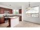 Bright kitchen featuring stainless steel appliances, wood cabinets, and granite countertops at 29606 N Tatum Blvd # 121, Cave Creek, AZ 85331